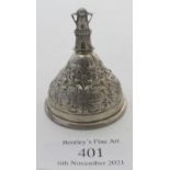 A small French silver bell with windmill finial embossed with country scenes, approx weight 33