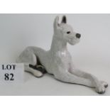 A crackle glazed Raku pottery Great Dane dog in recumbent pose, signed and dated to base. Length