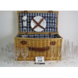 A large Wicker picnic hamper containing various plates, glasses, corkscrew etc. Overall size 56cm