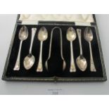 A set of six silver coffee spoons with matching sugar tongs, Sheffield 1927, boxed. Condition