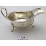 A silver sauce boat with wavy edge & pad feet, Sheffield 1932, approx weight 3.2 troy oz/100