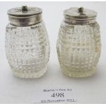 A pair of cut glass mustard & pepper pots with silver mounted tops, Birmingham 1903, James Dixon.
