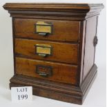 A three drawer set of oak Masonic Rival Letter File Transfer record drawers with brass fittings