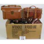 A large box of photography accessories including two leather shoulder bags and many cases, straps,