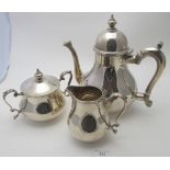 A good Garrard & Co silver three piece tea set in the Queen Anne style, London 1954-55, approx