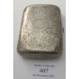 A silver cigarette case with gilded interior and flower & foliate engraving, monogrammed, Birmingham