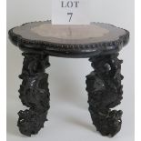 An antique Chinese rosewood low pot stand with inset pink marble top within a scalloped surround