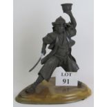 A well cast metal figure of a Japanese Samurai warrior on marble style plinth. Overall height