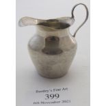 A small silver cream jug, approx 2" high, Birmingham 1903, approx weight 1 troy oz/31grams.