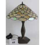 A Contemporary Tiffany style table lamp on bronze lotus leaf base with a pearl stained glass