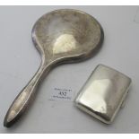 A silver hand mirror with bevelled glass, (hallmarks indistinct), and a silver cigarette case,