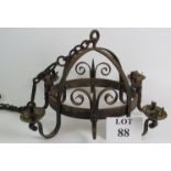 A Medieval style wrought iron four sconce chandelier with heavy handing chain. Max diameter 52cm.