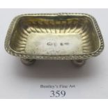 An antique Russian silver rectangular salt on ball feet with gilded interior, marked H.A, 83 and