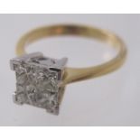 An 18ct yellow & white gold four invisible set diamond ring, diamonds approx 0.75cts, size M, approx