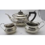 A late Victorian Georgian-revival silver three piece tea set by Mappin Brothers, 66 Cheapside &