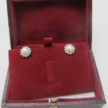 A pair of 9ct white gold pearl & diamond halo star earrings, boxed. Condition report: Good