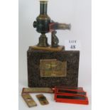 An antique German Magic Lantern by Ernst Plank, in original box with a quantity of glass slides