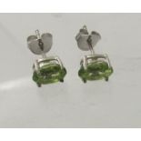 A pair of peridot stud earrings, backs marked 925, approx weight 1.6 grams. Condition report: Good