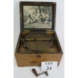 An antique German Symphonium music box with 7.5" disc housed in an oak case. Condition report: