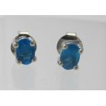 A pair of neon apatite stud earrings, stamped 925 on backs. Condition report: Good condition.
