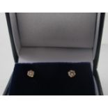 A pair of 18ct yellow gold approx 0.20ct diamond solitaire stud earrings, boxed. Condition report: