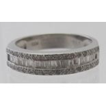 An 18ct white gold three row diamond ring with certificate, set with 57 round brilliant & baguette