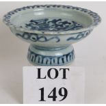 An antique Chinese porcelain pedestal dish with blue and white decoration and single character
