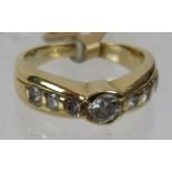 An 18ct yellow gold diamond ring set with centre diamond and three diamonds either side. Diamond