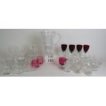 A collection of 22 punch and custard glasses, a cut crystal jug, two tumblers, a 6 piece cruet set