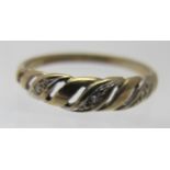 A small 9ct yellow gold ring set with three small diamonds in a rope design, size J, approx weight 1