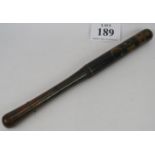 A Georgian painted wooden truncheon, ebonised hardwood decorated with G. R. C. under a crown. Length