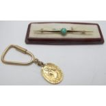 A 9ct gold keyring with 9ct gold St Christopher model and a 9ct gold bar brooch with centre