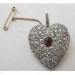 A fine yellow & white metal diamond encrusted brooch/pendant set with centre ruby surrounded by four