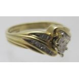 A 14ct yellow gold ring with centre marquise cut diamond, approx 0.15pts, and four bands of 24