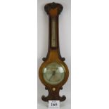 A Victorian Negretti and Zambra wheel barometer in oak veneer case with silvered dial. Overall