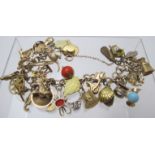 A 9ct gold charm bracelet with approx 35 charms, at least 23 mark 9ct gold, approx weight 59.7