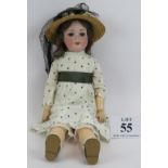A large Armand Marseille crying bisque headed doll with jointed composite arms and body, marked
