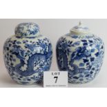 A pair of antique Chinese porcelain covered jars decorated in the Kangxi style with four claw