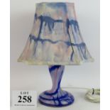 A vintage studio glass blue swirl lamp with hand decorated shade. Overall height 42cm. Condition