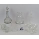 A seven piece engraved glass liqueur set, a similar engraved lemonade jug, an antique decanter,