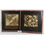 A pair of decorative Chinese cut paper panels each with written characters in the borders. Framed