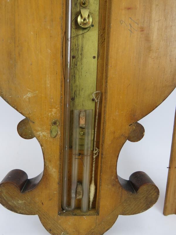 A Victorian Negretti and Zambra wheel barometer in oak veneer case with silvered dial. Overall - Image 6 of 6
