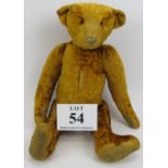 An antique style Mohair teddy bear. Hump to back, long limbs, sewn nose and pot belly