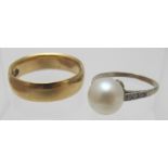 A vintage pearl ring with diamond shoulders, possibly platinum, size K and an 18ct gold wedding