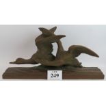 A 1930s French bronzed terracotta sculpture of two ducks, signed R. Rollin, stamped Terre C'Uite D'