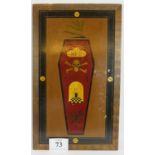 A hand painted Freemasons coffin symbol sign depicting a skull and cross bones and temple door