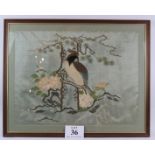 A super quality early 20th Century Chinese silk work of a bird in a magnolia tree. Framed and glazed