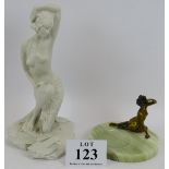 A reconstituted marble figure of an Art Deco style semi nude dancer and a Vrai bronze and onyx pin