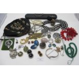 A large collection of mainly vintage jewellery to include an agate brooch, a small black & gold