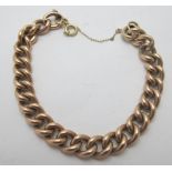 A 9ct gold link bracelet with safety chain, approx weight 16.8 grams. Condition report: Good